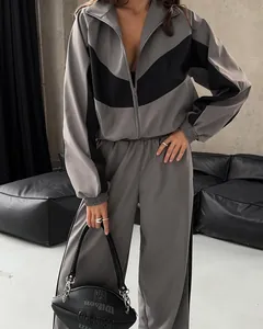 Detail view of women's color-block casual tracksuit with zip-up jacket and wide pants