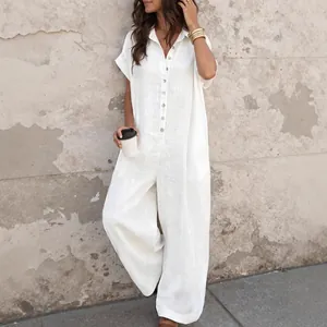 Relaxed fit white short-sleeved linen jumpsuit with front buttons for summer
