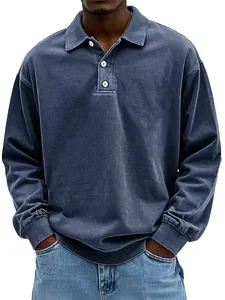 Detailed view of a men's loose long-sleeve polo shirt featuring a vintage washed blue texture.