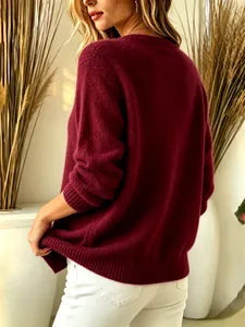Detailed back view of a burgundy knit sweater showing high-quality fabric texture.