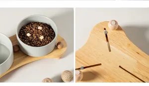 Vista dettagliata della ciotola in ceramica opaca su supporto in rovere con piedini.
