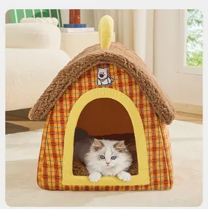 Close-up of a white cat inside a cozy enclosed plaid pet house with fuzzy roof