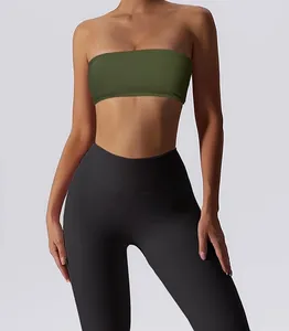 Detail view of a women's olive green strapless sports tube top on a fitness model