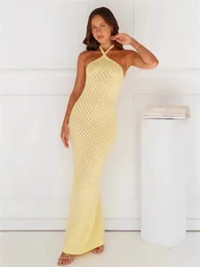Elegant pale yellow knitted halter maxi dress with crochet diamond pattern for beach