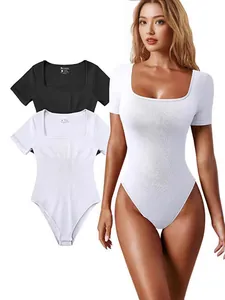 Detailed view showing the ribbed texture and fit of women's yoga bodysuit in white and black