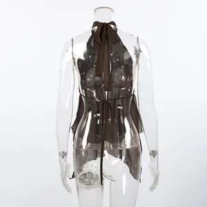Back view of brown beach chiffon halter vest featuring adjustable tie details on mannequin
