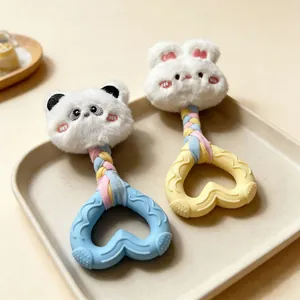 Detail view of heart-shaped squeaky plush dog chew toys with cute animal designs.