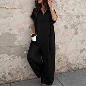 Casual black short sleeve button-up jumpsuit with wide legs for a relaxed summer street look