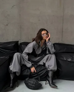 Stylish grey and black color block tracksuit for women, casual two-piece zip jacket and pants.