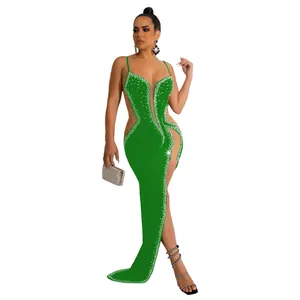 Full-length view of a green rhinestone evening gown with sheer mesh side cut-outs