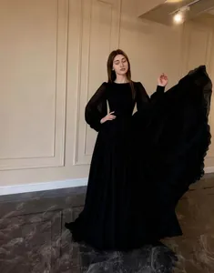 Elegant black long-sleeved double-layer chiffon gown with flowing maxi skirt detail