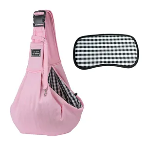 Pink pet sling carrier bag with checkered lining and matching bottom board for travel comfort