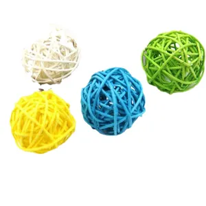 Colorful rattan balls for parrots and small pet birds to chew and play on white background