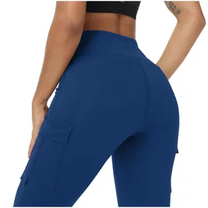 Detailed macro view of high-waist blue yoga pants showing the side cargo pocket.