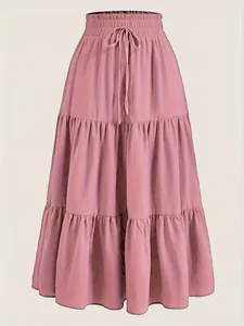 Detailed view of plus size pink tiered maxi cake skirt with elastic drawstring waist.