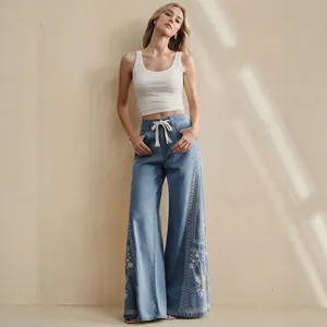 Bohemian high waist wide leg denim jeans with white floral embroidery and drawstring