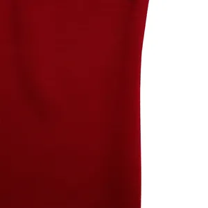 Macro view showing the detailed fine horizontal texture of the red dress fabric material