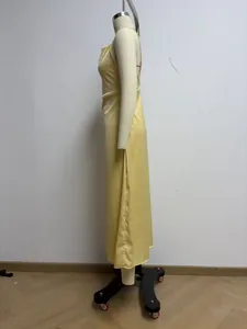 Detailed side profile of a glossy yellow satin cowl neck midi dress on a mannequin