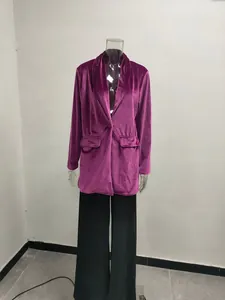 Full view of a long purple velvet blazer jacket displayed on a clear mannequin