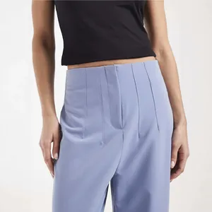 High-waisted light blue straight-leg suit trousers for women in a commuter style.