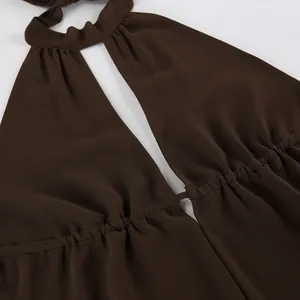 Close-up detail of brown chiffon halter top showing neckline and pleated texture