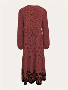 Back view of a long-sleeved burgundy floral print maxi dress with tiered skirt design.