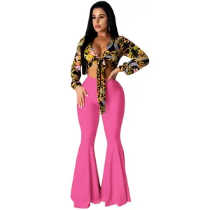 Two-piece sexy nightclub outfit with floral tie-front top and pink flare pants set
