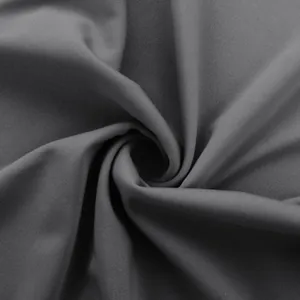 Detailed macro view showing the fine texture of grey high-stretch yoga pants fabric