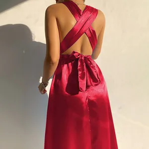 Detailed back view of a red satin evening dress featuring an elegant criss-cross design