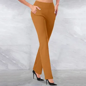 Close-up of high waisted ginger yoga pants on a model showing the fit and tummy control effect