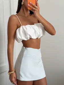Detailed view of a white satin ruffled crop top, perfect for sexy summer fashion.