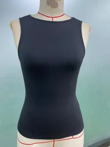 Close-up front view of a black slim-fit elastic sleeveless tank top on a professional mannequin