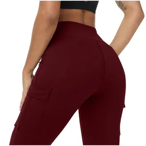Close-up of burgundy high-waisted yoga leggings with functional side cargo pockets