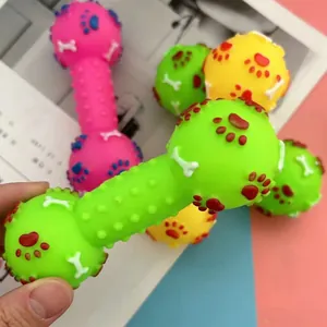 Detailed view of colorful squeaky dumbbell dog chew toy with embossed paw and bone patterns