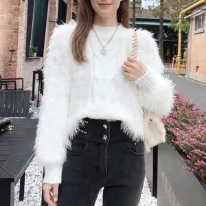 Elegant white cable knit fuzzy sweater for a cozy and stylish winter look