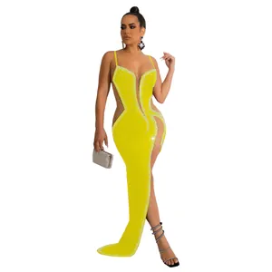Detailed view of sexy yellow evening dress with rhinestones and sheer mesh panels