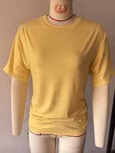 Detailed view of women's slim fit yellow T-shirt featuring stylish side ruched design