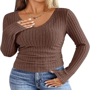 Close-up detail of women's slim V-neck long sleeve ribbed knit T-shirt in brown