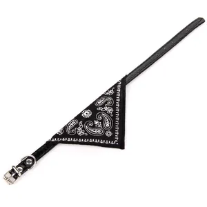 Close-up detail of black PU pet collar featuring a white paisley print bandana scarf