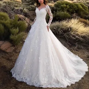 Elegant white lace wedding dress featuring long sleeves and a long cathedral train
