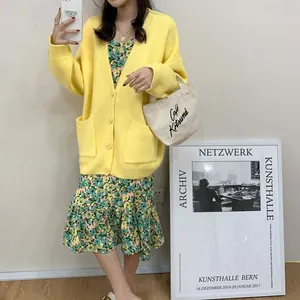 Cozy oversized yellow V-neck knitted cardigan with front pockets for casual autumn fashion