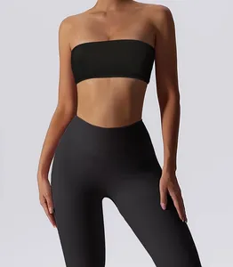 Front view detail of a black strapless tube top and matching high-waist sports leggings