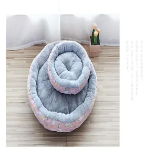 Comfortable round plush pet bed with cute cartoon pattern for cats and small dogs
