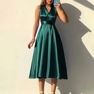Elegant dark green satin evening dress featuring a deep V-neck and a slimming high waist design