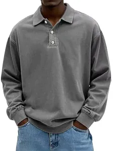 Detail view of washed grey men's polo shirt with three-button lapel and soft texture