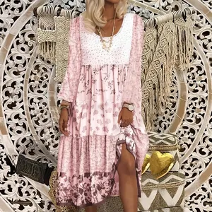 Bohemian pink floral long sleeve maxi dress with round neck and tiered skirt design