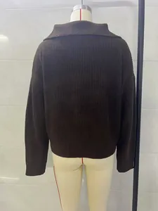 Back view of a brown oversized knitted sweater with a turnover V-collar on mannequin.