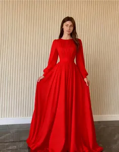 Elegant long-sleeved red French palace style chiffon gown with pleated bodice detail