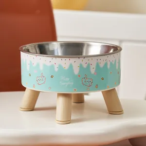Elevated stainless steel pet bowl with cute cat print and wooden legs for neck protection