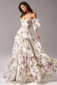 Elegant off-shoulder organza maxi dress with floral print and tiered ruffle skirt detail.